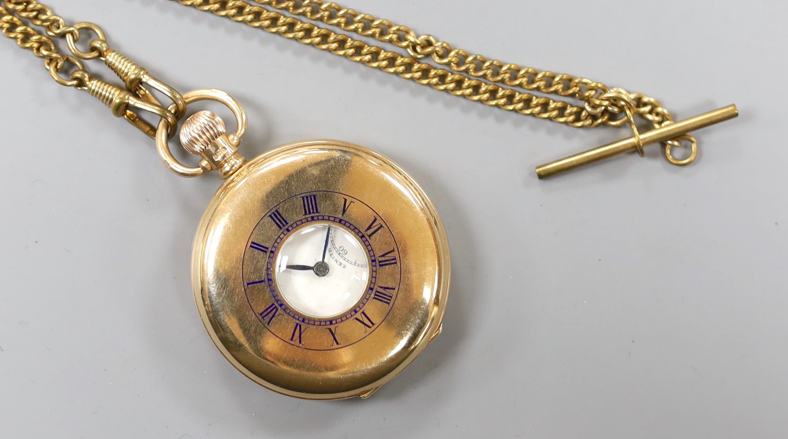 A George V 9ct gold half hunter keyless Zenith pocket watch, case diameter 50mm, gross 99 grams, with a gilt metal albert.